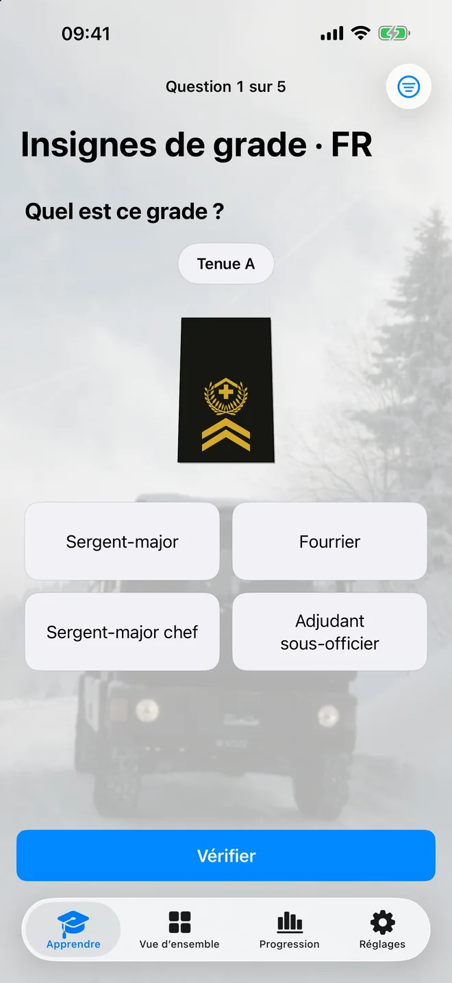 Un insigne de la tenue A et quatre réponses dans le quiz en français sur iPhone.